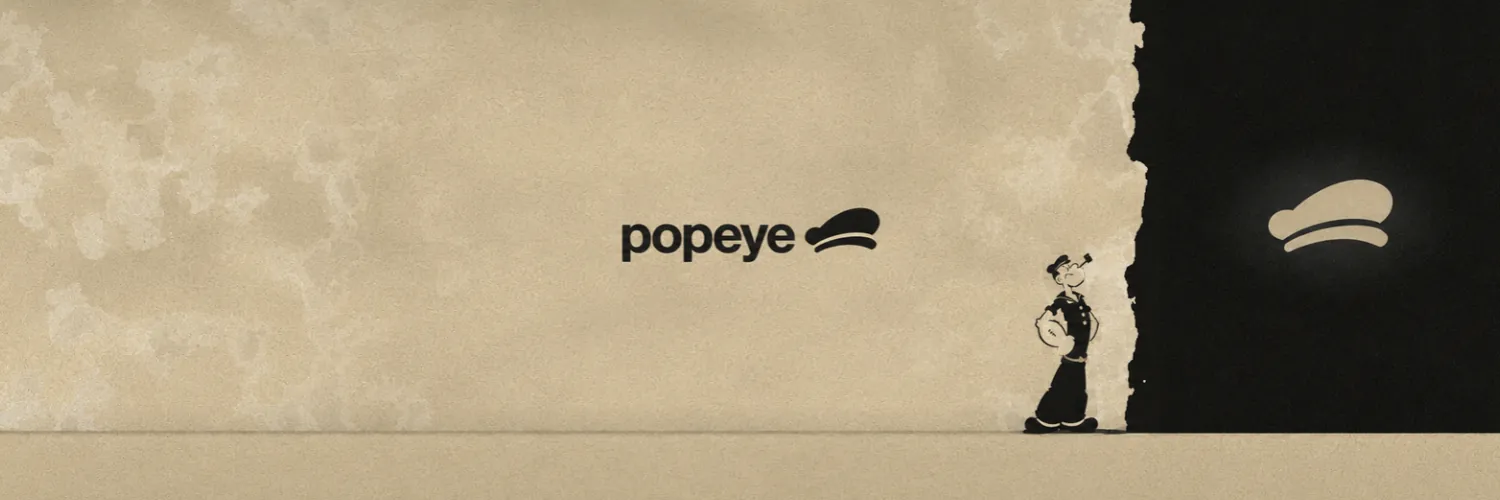 Popeye wordmark and cap beside a sailor silhouette, sand paper tearing into black